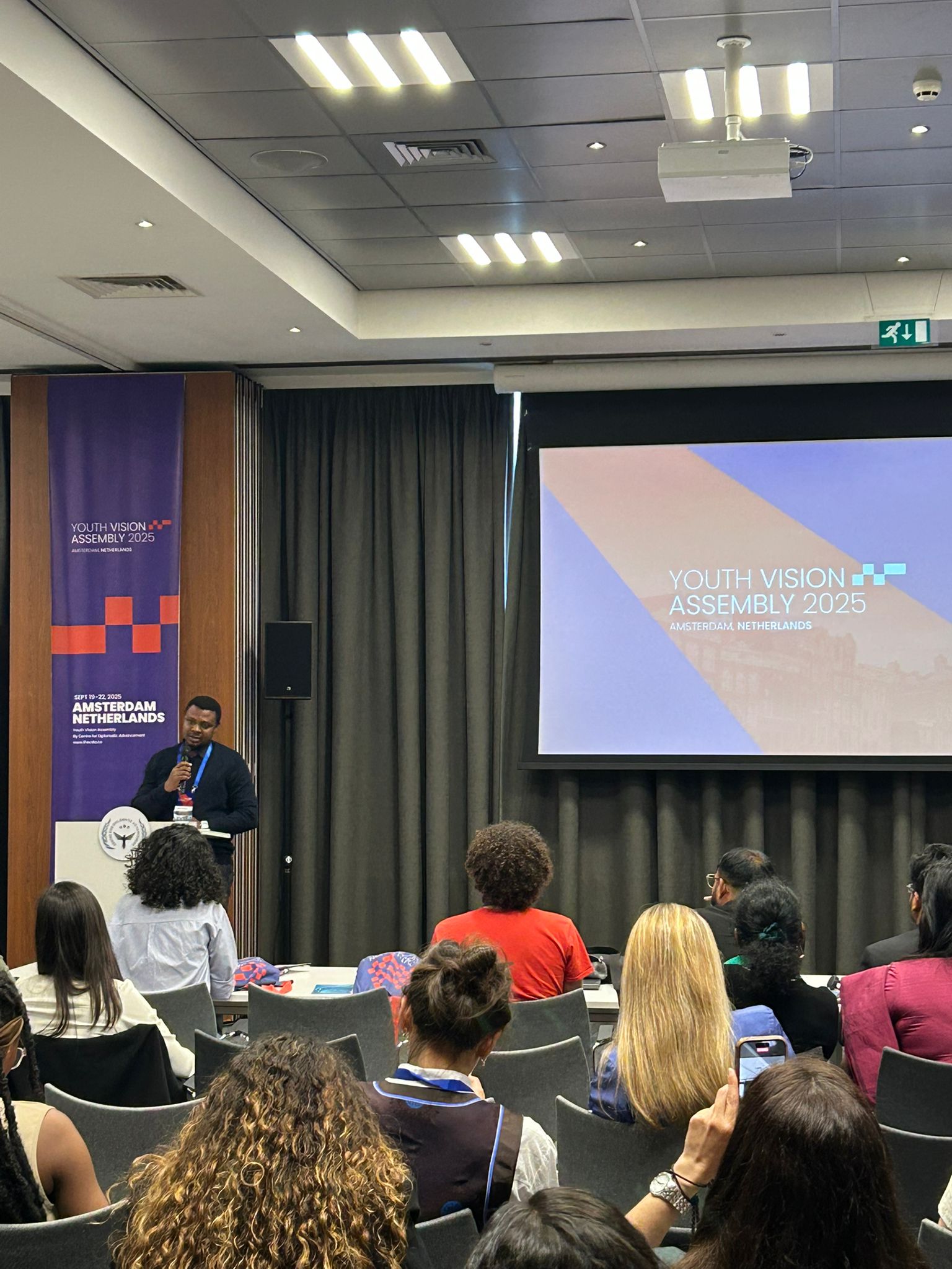 Ojonugwa Wada speaking on rural innovation in Amsterdam at Youth Assembly 2025